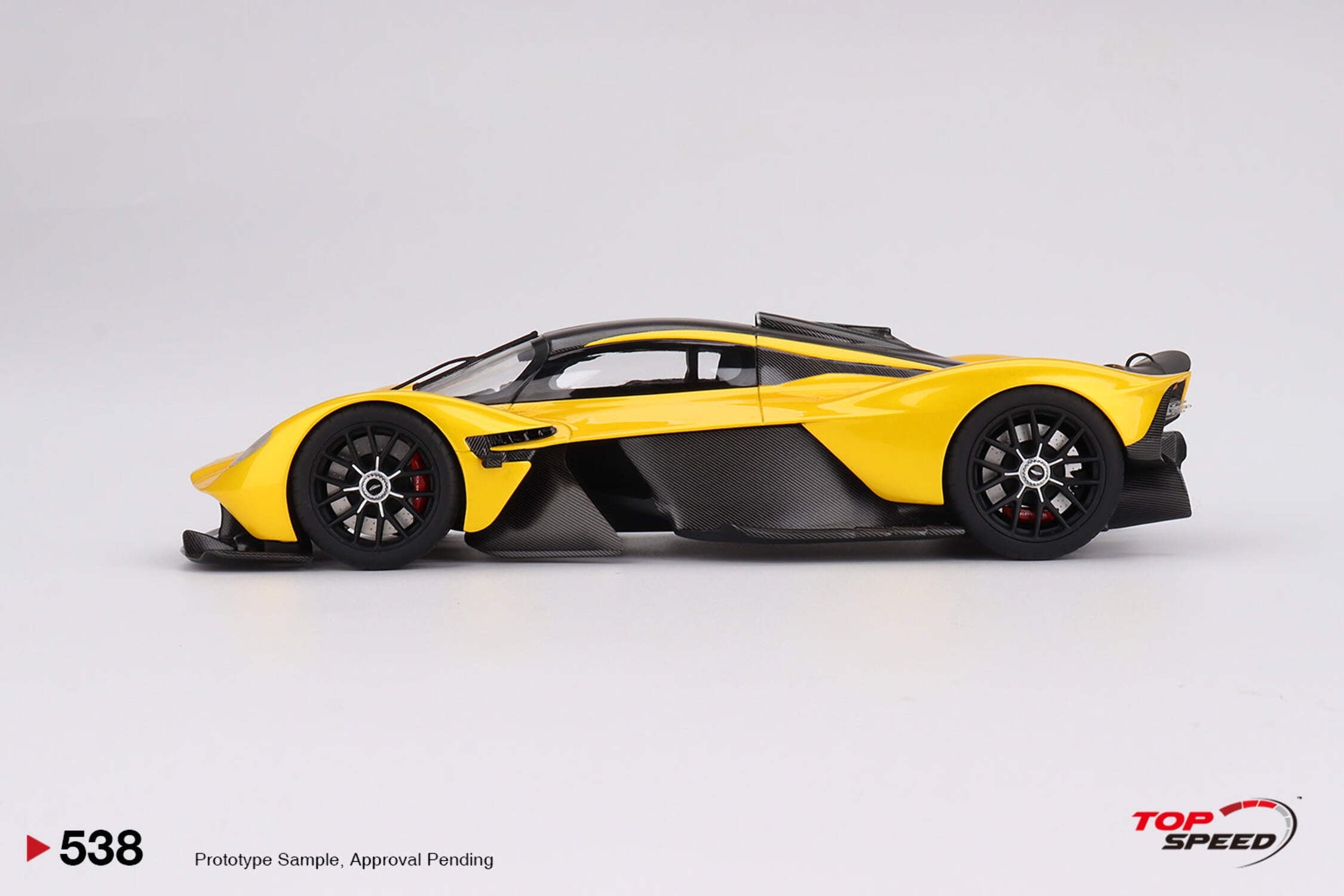 Aston Martin Valkyrie Cosmopolitan Yellow Metallic and Carbon 1/18 Model Car by Top Speed