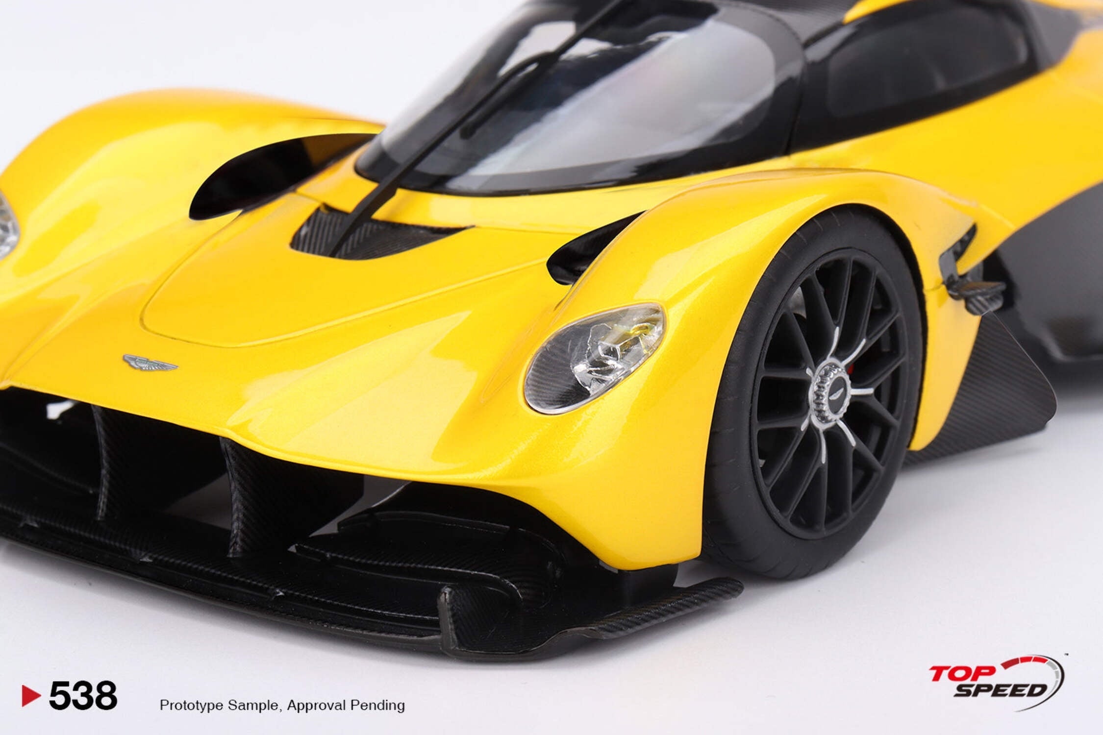 Aston Martin Valkyrie Cosmopolitan Yellow Metallic and Carbon 1/18 Model Car by Top Speed