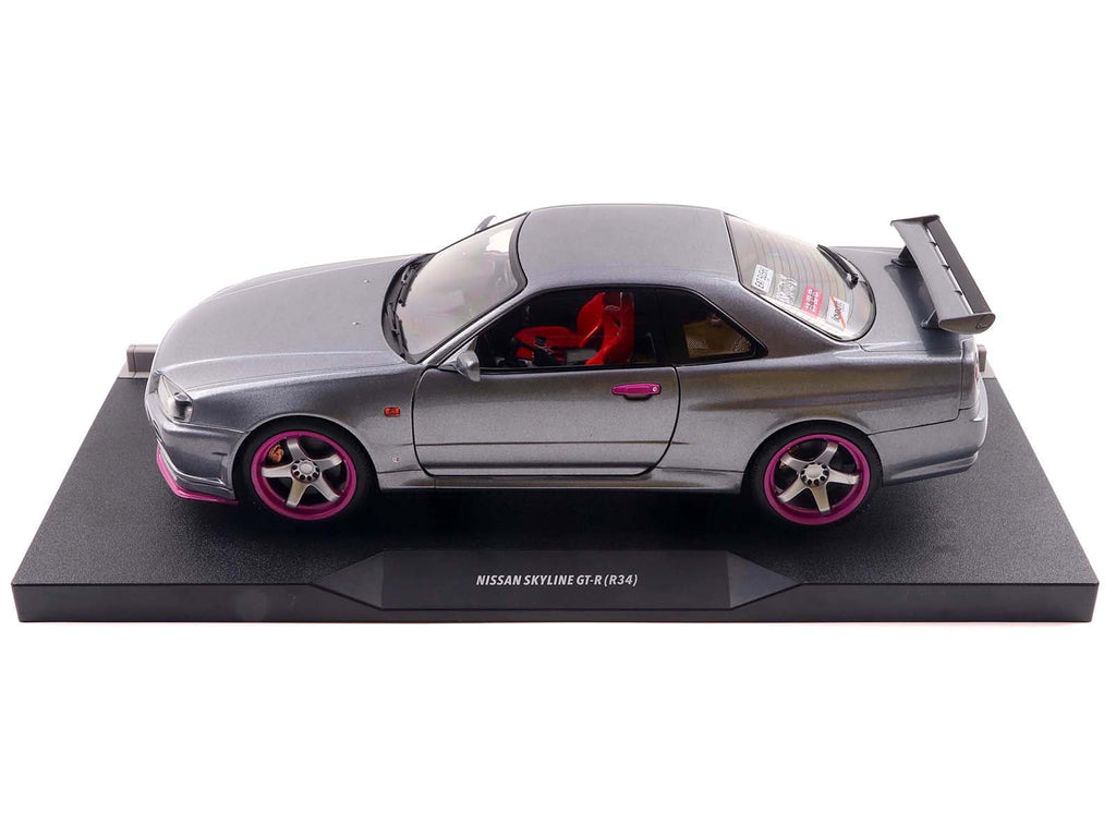 1999 Nissan Skyline GT-R (R34) RHD (Right Hand Drive) Silver Metallic with Purple Wheels 1/18 Diecast Model Car by Solido