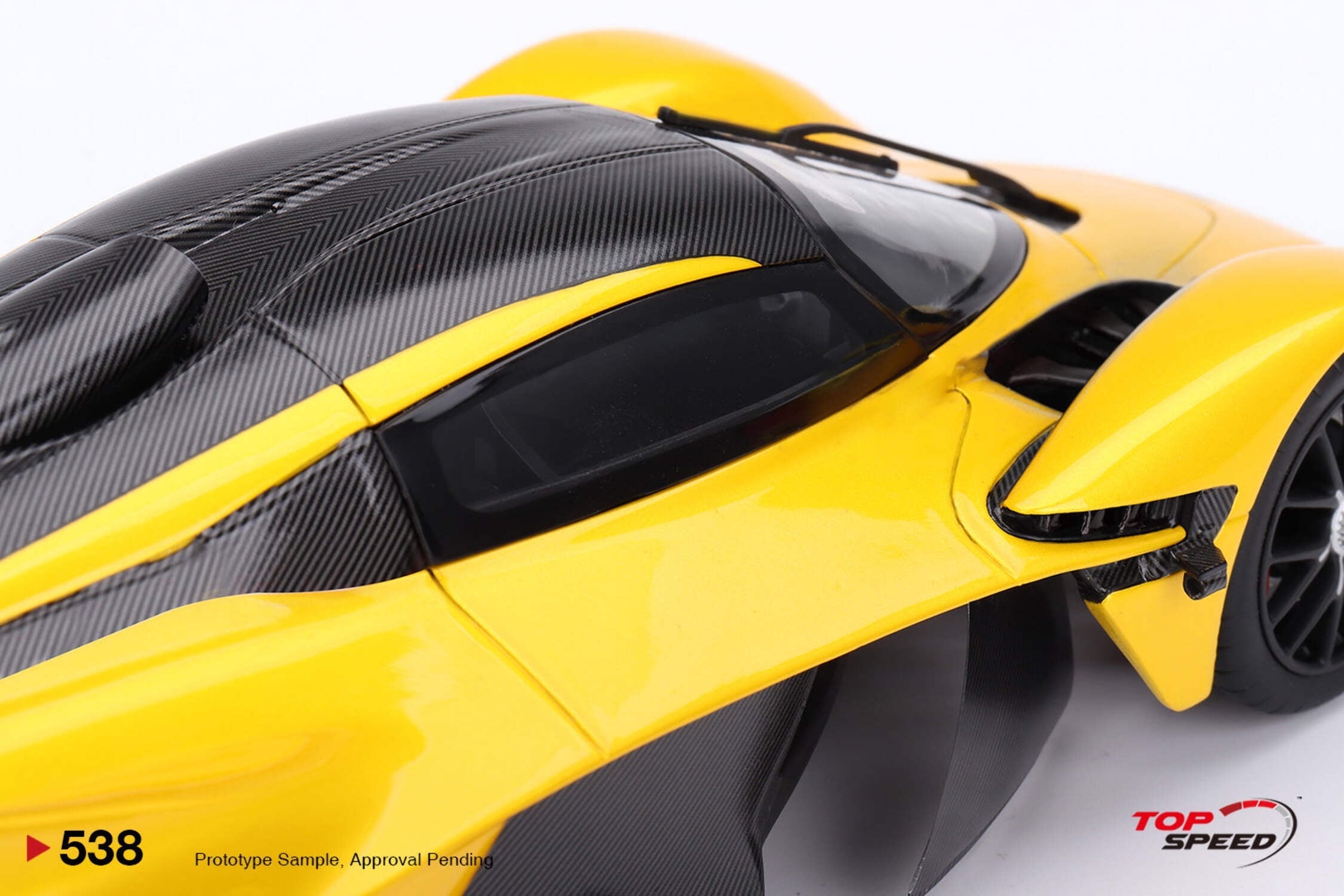 Aston Martin Valkyrie Cosmopolitan Yellow Metallic and Carbon 1/18 Model Car by Top Speed